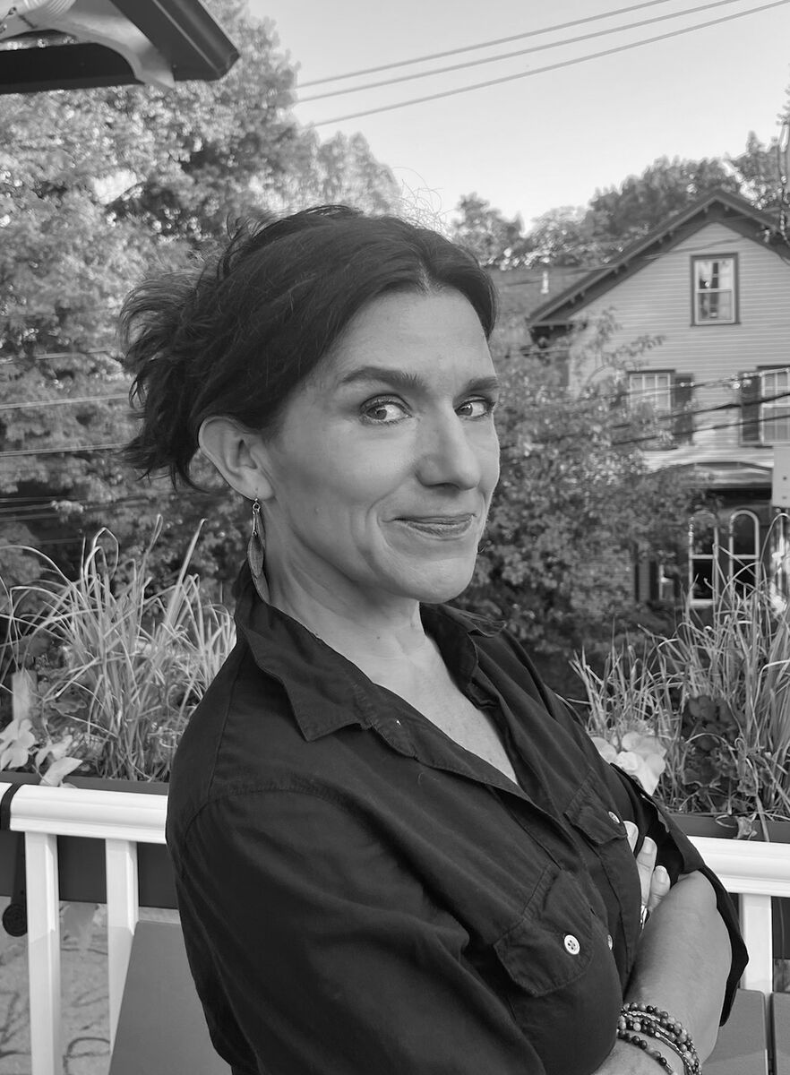 Gretchen Heefner starring at the camera with crossed amrs