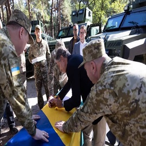 image of men in military gear and congressman