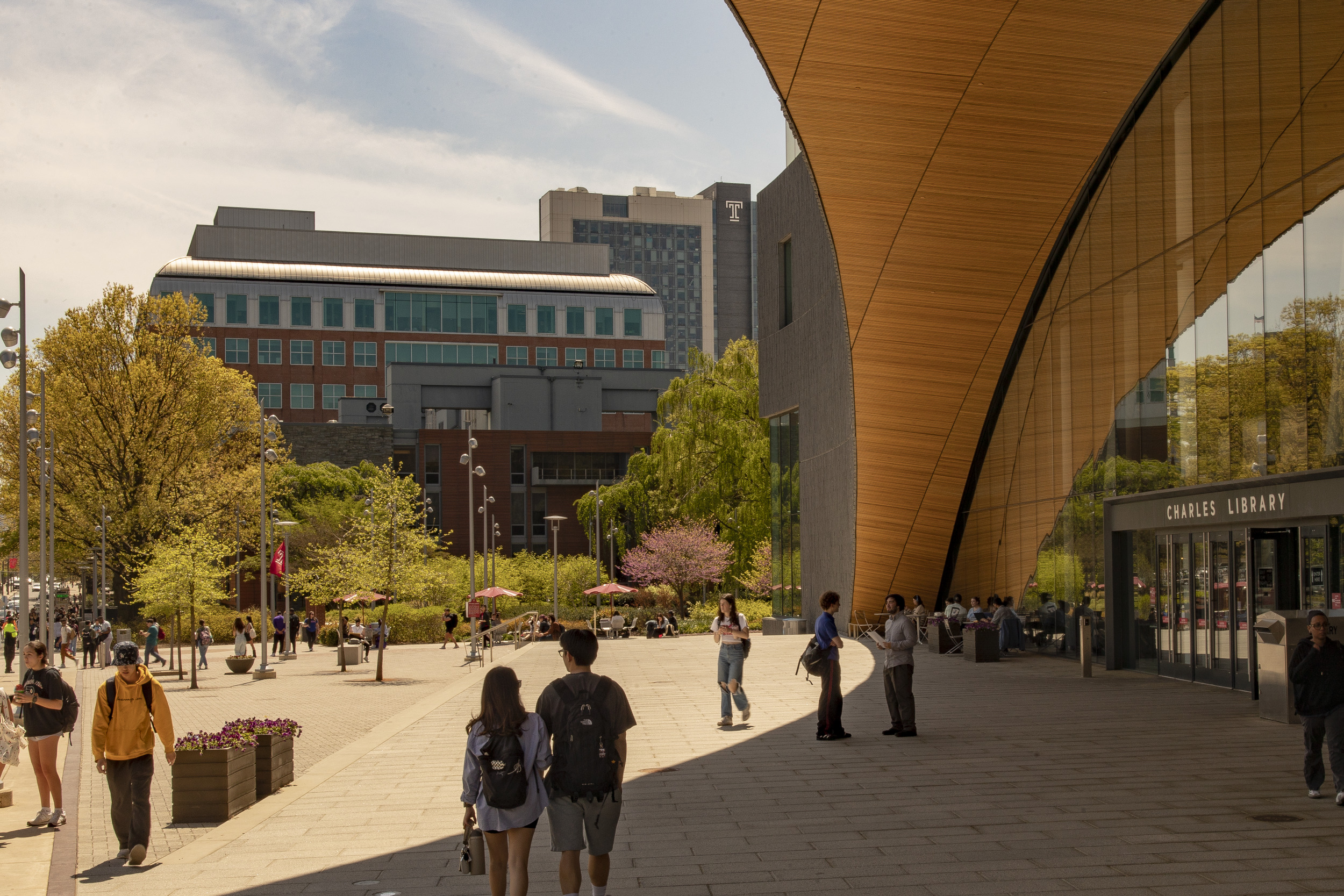 Students walking on campus outside Charles Library