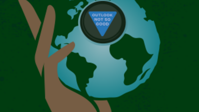 image of a brown hand holding a globe against a green background