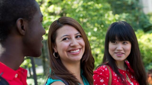 Three international students talking to each other on Temple s Main Campus.