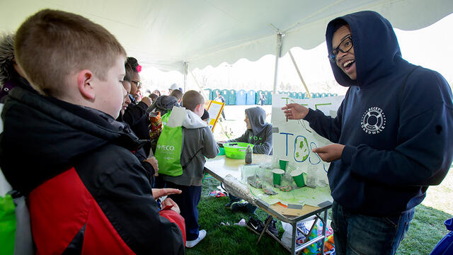 An exhibitor at Temple EarthFest 2015 talking to children about his project.