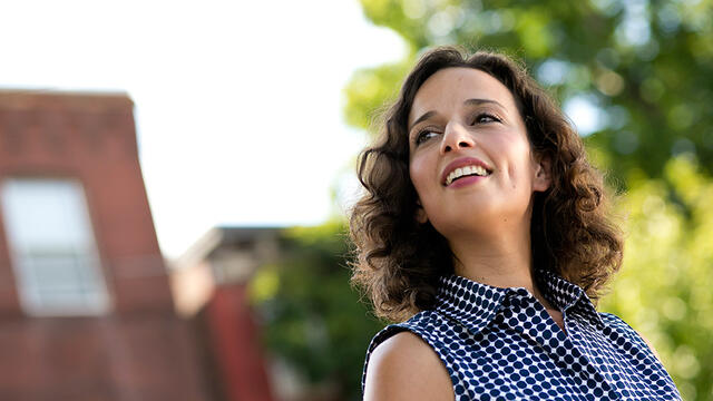 Yasmine Mustafa standing outside smiling.