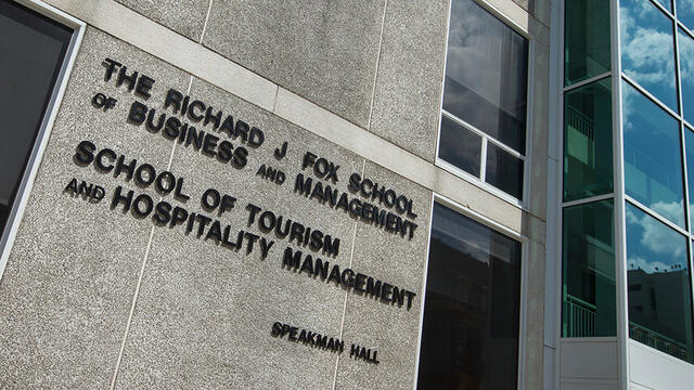 A sign for Temple's School of Tourism and Hospitality Management, which will be renamed.