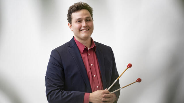 Caleb Breidenbaugh holding a xylophone hammer.