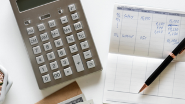 calculator, pen and w-2 form