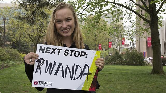 Maggie Andresen holding a sign that says