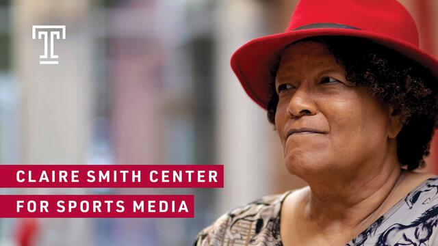 Claire Smith wearing a red hat and a black and white blouse