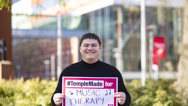 Gabriel holding a sign 