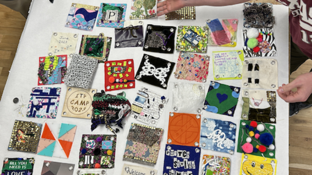 Quilt squares on a table.