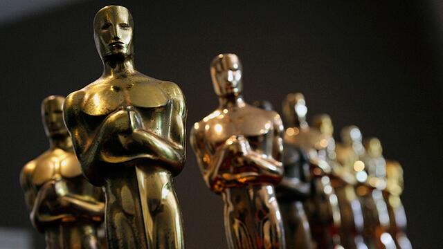 Several Oscar statuettes.