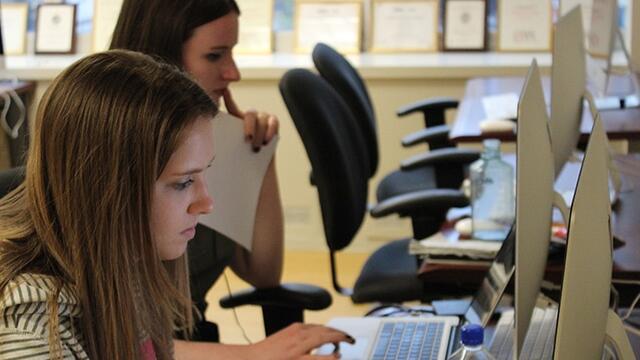 Student-journalists using computers in the Philadelphia Neighborhoods newsroom.