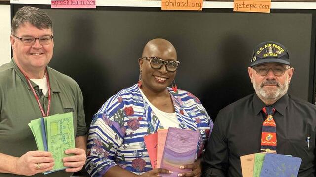 Len Clark, director of emergency management (left), standing with Joe Spera, director of technology for Temple s Public Safety Department, visited a class to speak about Veterans Day.