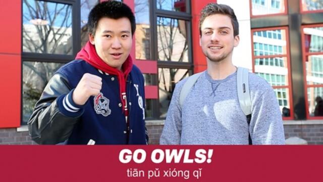 A student learning a Temple cheer in Mandarin.