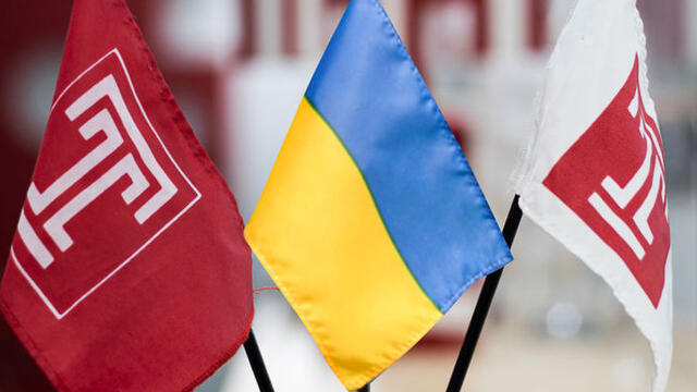 Image of the Ukrainian flag and two Temple flags.