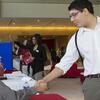 Student shaking hands with potential employer.