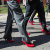 Men walking around Main Campus in red high heels.