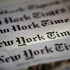 A spread of several New York Times newspapers.