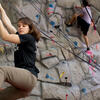 Zoe Steinberg climbing a rock wall