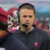 Rhule on the sidelines wearing a game headset