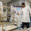 Image of Md Saiful Islam demonstrating his foam fractionation system at the College of Engineering.