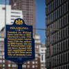 Sign of Philadelphia in front of buildings