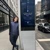 Owen Barbagallo in front of a LinkNYC kiosk in New York City