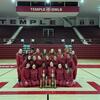 Image of Temple s dance team wearing cherry and white posing in front of trophies.