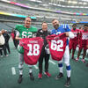 Image of Peyton Manning and Jason Kelce with Temple football at Lincoln Financial Field.