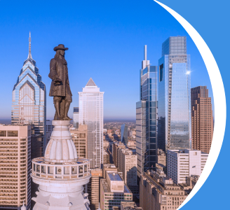 image of Ben Franklin statue in center city Philadelphia with the skyline of the city behind